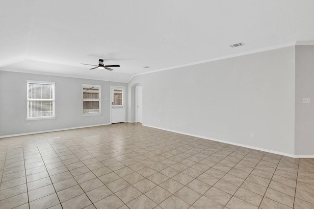 1302 Copper St, Princeton, TX 75407 - unfurnished room featuring crown molding, ceiling fan, baseboards, light tile patterned flooring, and arched walkways