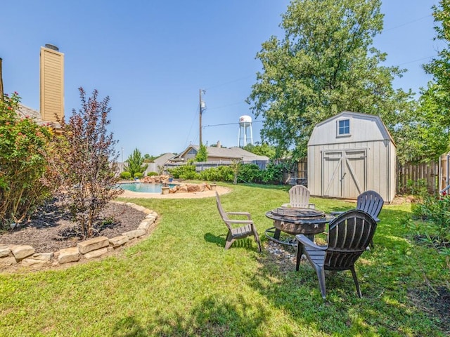 2103 Ridgewood Dr, Bridgeport, TX 76426 - view of yard featuring a fire pit, a storage shed, and an outbuilding