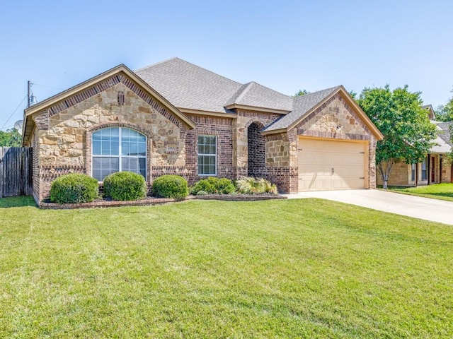 2103 Ridgewood Dr, Bridgeport, TX 76426 - view of front facade featuring an attached garage, stone siding, concrete driveway, and a shingled roof