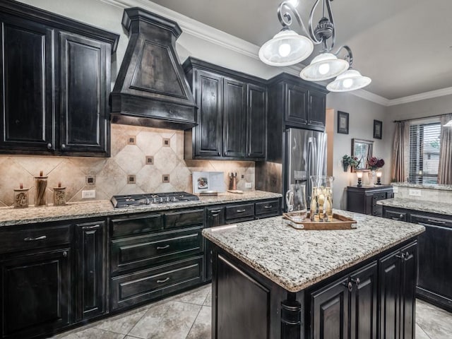 1650 Winding Creek Ln, Rockwall, TX 75032 - kitchen featuring dark cabinets, appliances with stainless steel finishes, a center island, custom exhaust hood, and decorative backsplash