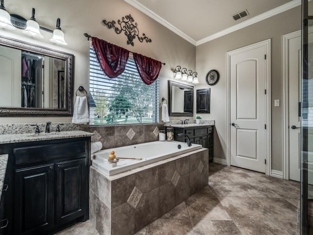 1650 Winding Creek Ln, Rockwall, TX 75032 - bathroom featuring ornamental molding, a garden tub, and two vanities