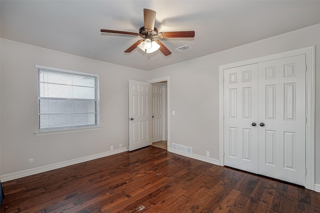 6109 Rayburn Ct, Fort Worth, TX 76133 - unfurnished bedroom with dark wood-type flooring, baseboards, a closet, and a ceiling fan