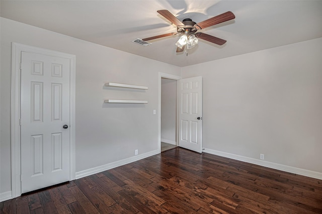 6109 Rayburn Ct, Fort Worth, TX 76133 - empty room featuring dark wood-style flooring, baseboards, and a ceiling fan