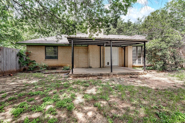6109 Rayburn Ct, Fort Worth, TX 76133 - rear view of property with brick siding and a patio