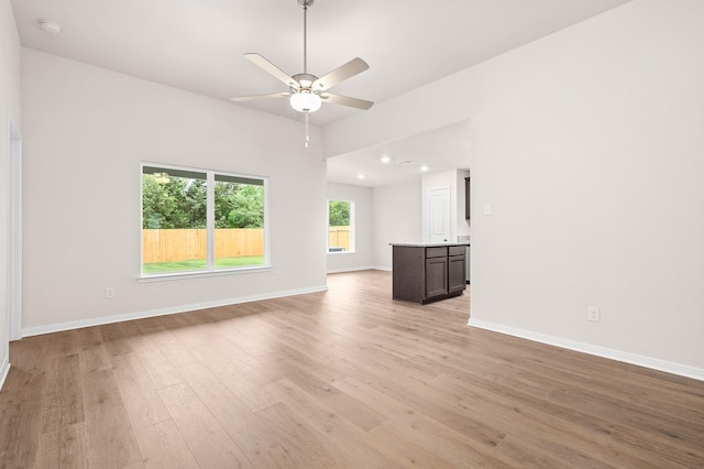 221 Southgate Dr, Terrell, TX 75160 - unfurnished living room featuring light wood finished floors, a ceiling fan, baseboards, and recessed lighting
