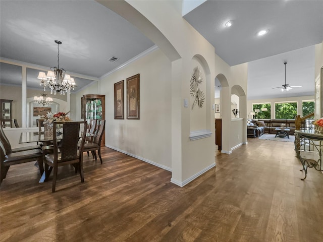4305 Diplomacy Dr, Rowlett, TX 75089 - dining area with dark wood-type flooring, a ceiling fan, baseboards, arched walkways, and crown molding