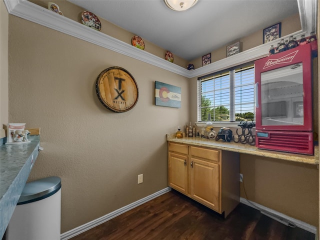 4305 Diplomacy Dr, Rowlett, TX 75089 - bar area featuring dark wood-type flooring, built in desk, and baseboards