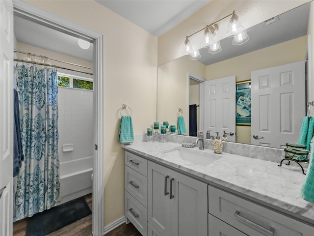 4305 Diplomacy Dr, Rowlett, TX 75089 - full bathroom featuring vanity, shower / tub combo with curtain, and baseboards