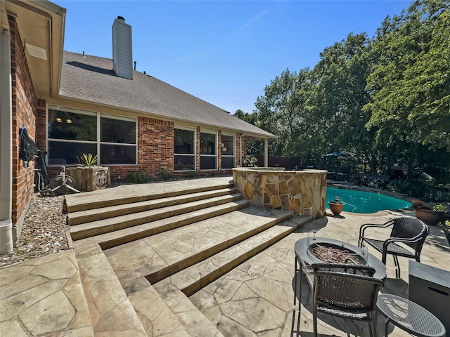 4305 Diplomacy Dr, Rowlett, TX 75089 - view of patio / terrace featuring a fire pit and an outdoor pool