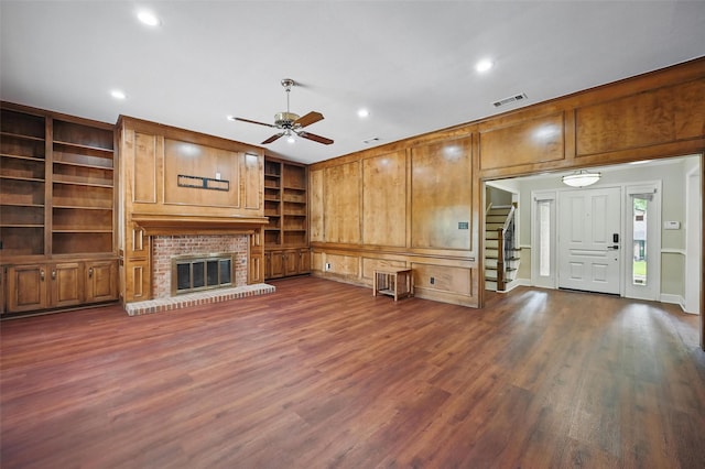 4705 Woodview St, Arlington, TX 76013 - unfurnished living room featuring built in shelves, ceiling fan, stairs, dark wood-style floors, and recessed lighting