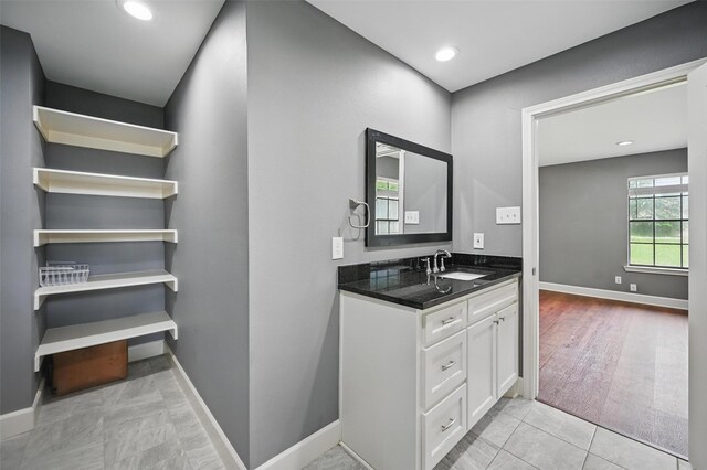 4705 Woodview St, Arlington, TX 76013 - bathroom featuring baseboards, vanity, and recessed lighting