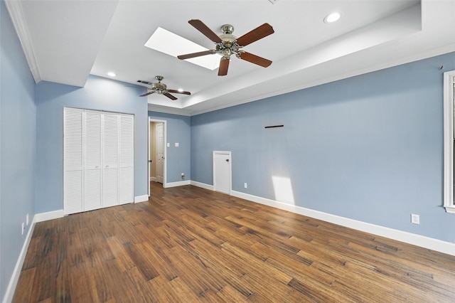 4705 Woodview St, Arlington, TX 76013 - unfurnished bedroom featuring recessed lighting, baseboards, wood finished floors, a raised ceiling, and ceiling fan