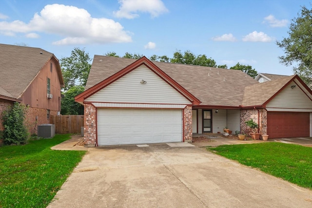 7710 Sable Ln, North Richland Hills, TX 76182 - view of front of property with brick siding, an attached garage, central AC unit, and driveway