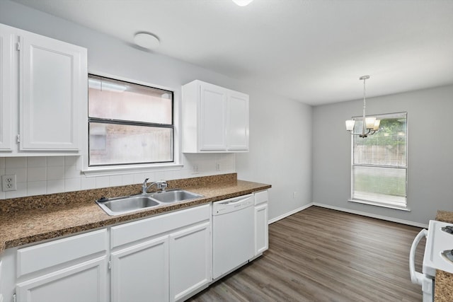 7710 Sable Ln, North Richland Hills, TX 76182 - kitchen with white appliances, a sink, dark countertops, and white cabinetry