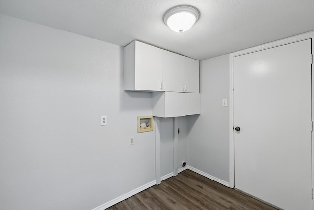 7710 Sable Ln, North Richland Hills, TX 76182 - laundry area with cabinet space, washer hookup, dark wood-type flooring, hookup for an electric dryer, and baseboards