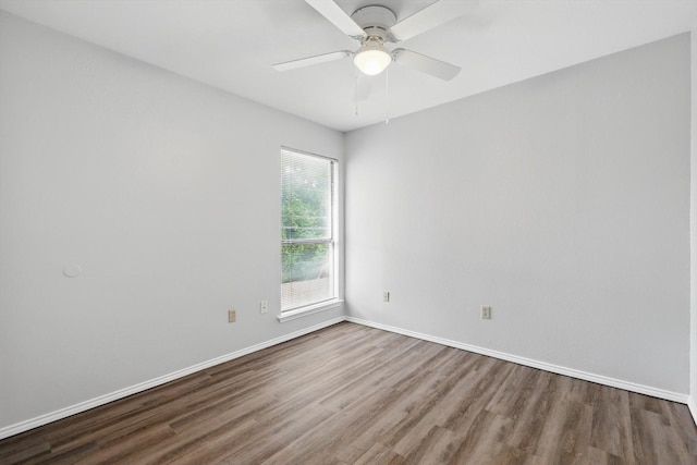 7710 Sable Ln, North Richland Hills, TX 76182 - spare room featuring wood finished floors, baseboards, and a ceiling fan