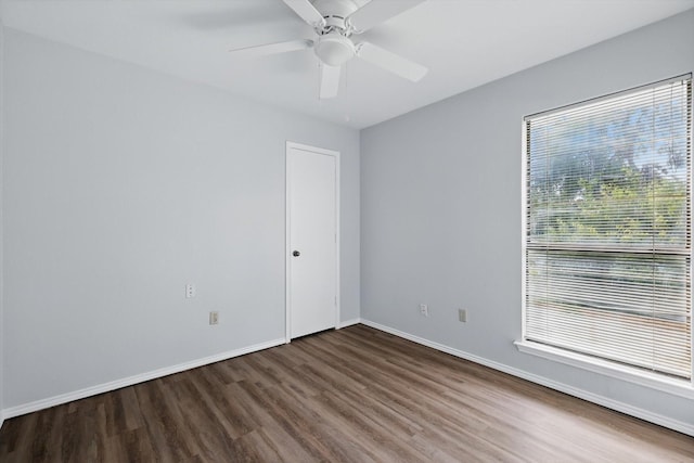 7710 Sable Ln, North Richland Hills, TX 76182 - unfurnished room featuring wood finished floors, a ceiling fan, and baseboards