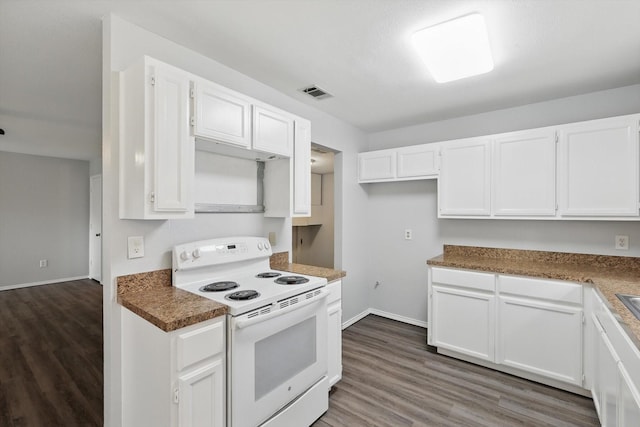 7710 Sable Ln, North Richland Hills, TX 76182 - kitchen featuring white electric range oven, white cabinetry, and dark wood-type flooring