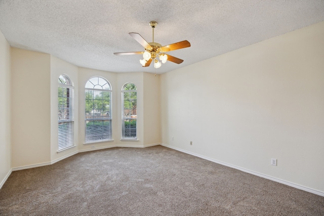 1086 Whispering Gln, Rockwall, TX 75087 - carpeted spare room with a textured ceiling, ceiling fan, and baseboards