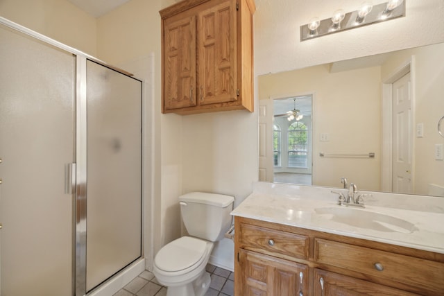 1086 Whispering Gln, Rockwall, TX 75087 - full bathroom featuring a stall shower, toilet, tile patterned flooring, and vanity
