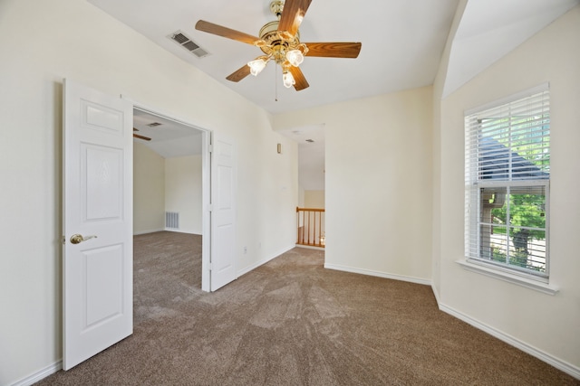 1086 Whispering Gln, Rockwall, TX 75087 - spare room featuring carpet floors, plenty of natural light, ceiling fan, and baseboards