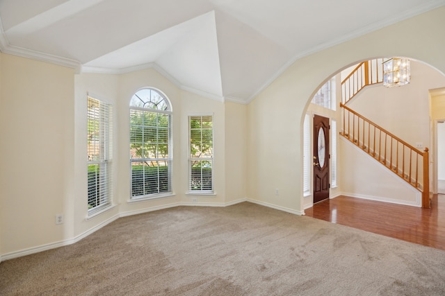 1086 Whispering Gln, Rockwall, TX 75087 - carpeted empty room with a chandelier, baseboards, vaulted ceiling, stairway, and ornamental molding