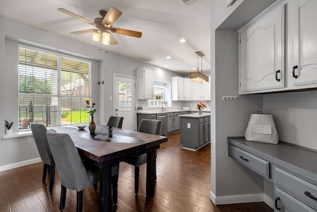 dining space featuring baseboards, dark wood finished floors, a ceiling fan, and recessed lighting