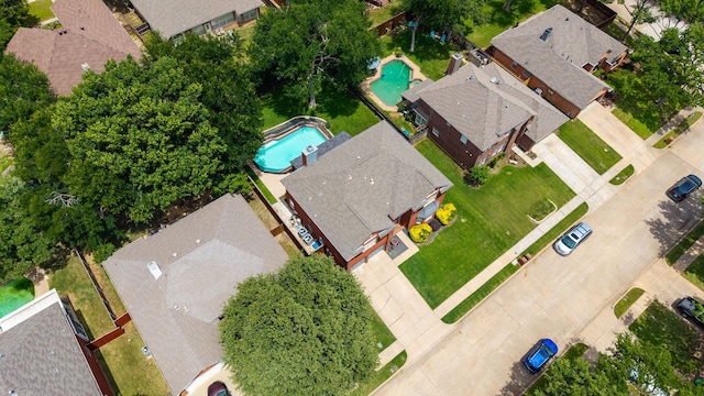 aerial view of residential area featuring a pool