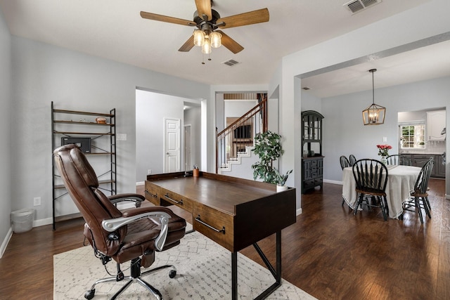 office area with wood finished floors, baseboards, a ceiling fan, and a chandelier