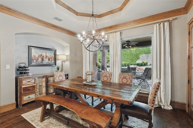603 Comal Ct, Keller, TX 76248 - dining area featuring dark wood-type flooring, a raised ceiling, a chandelier, ornamental molding, and baseboards