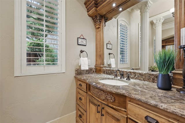 603 Comal Ct, Keller, TX 76248 - bathroom featuring a textured wall, vanity, and ornate columns