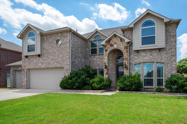 3449 Ava Dr, Midlothian, TX 76065 - view of front facade with an attached garage, a front yard, driveway, and brick siding