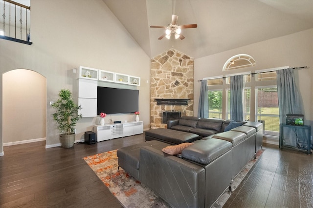3449 Ava Dr, Midlothian, TX 76065 - living area with high vaulted ceiling, a ceiling fan, arched walkways, wood-type flooring, and a stone fireplace