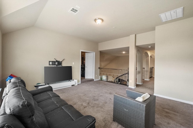 3449 Ava Dr, Midlothian, TX 76065 - carpeted living area with arched walkways, baseboards, and lofted ceiling
