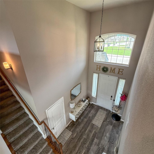 5202 Fallen Tree Dr, Temple, TX 76502 - foyer entrance featuring stairway, a high ceiling, a chandelier, and dark wood-style floors