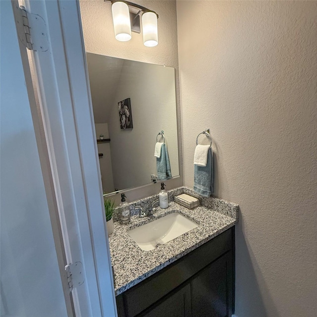5202 Fallen Tree Dr, Temple, TX 76502 - bathroom with a textured wall and vanity