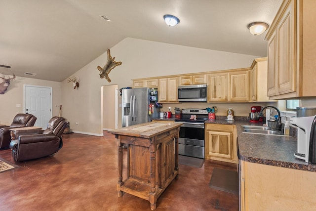 7909 W Fm 1753, Ravenna, TX 75476 - kitchen with stainless steel appliances, a sink, lofted ceiling, open floor plan, and light brown cabinetry