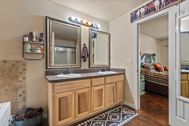 7909 W Fm 1753, Ravenna, TX 75476 - bathroom featuring ensuite bath, double vanity, and finished concrete floors