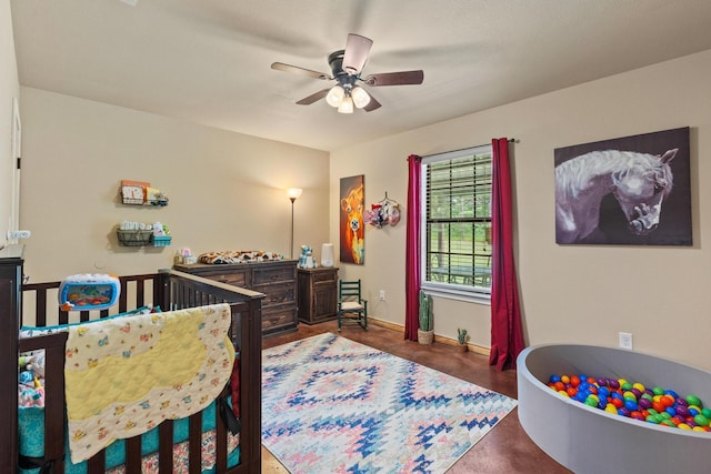 7909 W Fm 1753, Ravenna, TX 75476 - bedroom featuring a nursery area, baseboards, concrete floors, and a ceiling fan