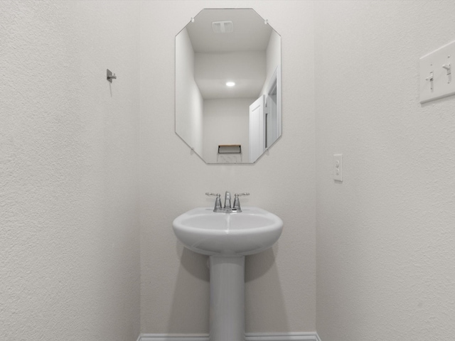 6020 Paddock Ln, Little Elm, TX 76227 - bathroom with a sink and baseboards