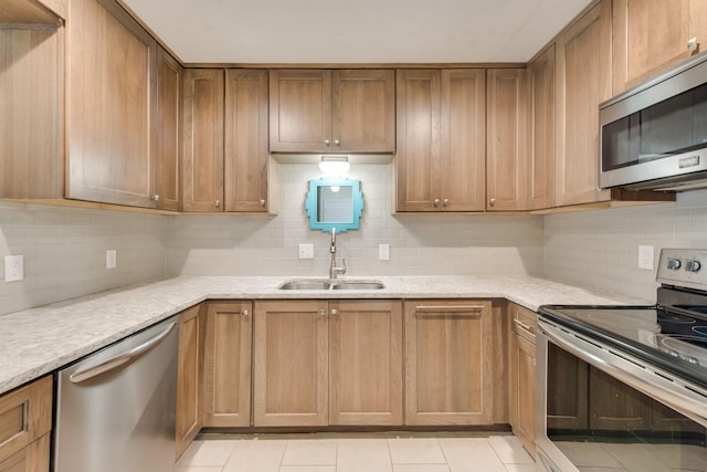 926 Meadowbrook Dr, Grapevine, TX 76051 - kitchen with stainless steel appliances, a sink, decorative backsplash, light tile patterned flooring, and brown cabinets