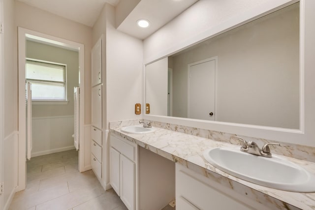 926 Meadowbrook Dr, Grapevine, TX 76051 - bathroom with double vanity and tile patterned floors