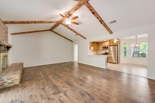 926 Meadowbrook Dr, Grapevine, TX 76051 - unfurnished living room with a ceiling fan, a fireplace, wood finished floors, and a chandelier