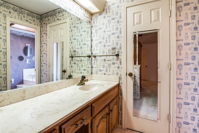 2512 Shadow Lane Dr, Mckinney, TX 75072 - bathroom with wallpapered walls and vanity