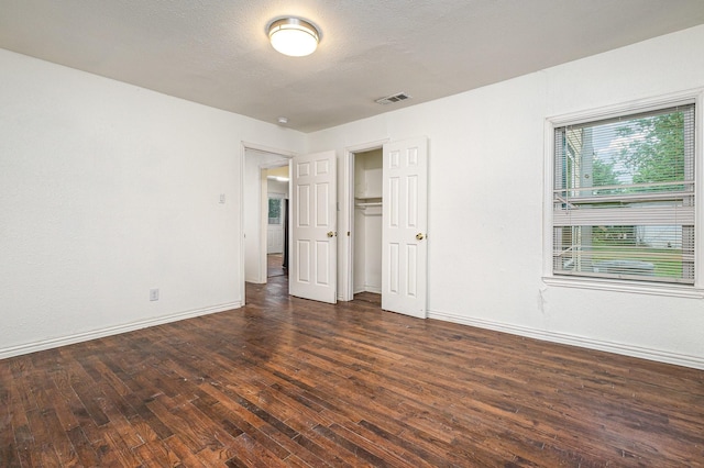 5844 Boone St, Sachse, TX 75048 - unfurnished bedroom with hardwood / wood-style floors and a closet