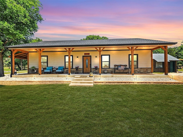 6025 Fm 902, Gainesville, TX 76240 - back of house with a lawn and a shingled roof
