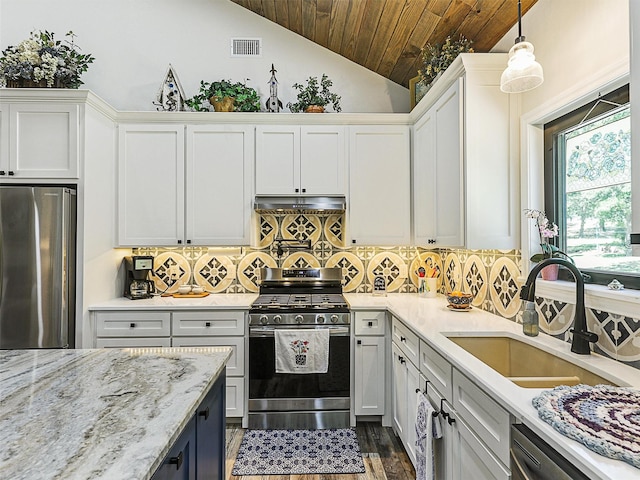 6025 Fm 902, Gainesville, TX 76240 - kitchen with appliances with stainless steel finishes, wooden ceiling, a sink, vaulted ceiling, and dark wood-type flooring