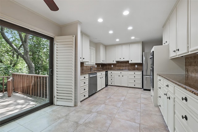 202 Rainbow Cir, Rockwall, TX 75032 - kitchen featuring stainless steel appliances, decorative backsplash, recessed lighting, light tile patterned flooring, and a sink