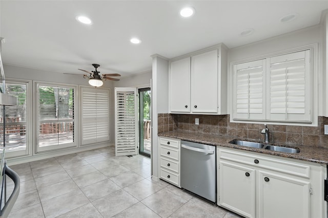 202 Rainbow Cir, Rockwall, TX 75032 - kitchen featuring stainless steel dishwasher, a sink, a ceiling fan, decorative backsplash, and dark stone countertops