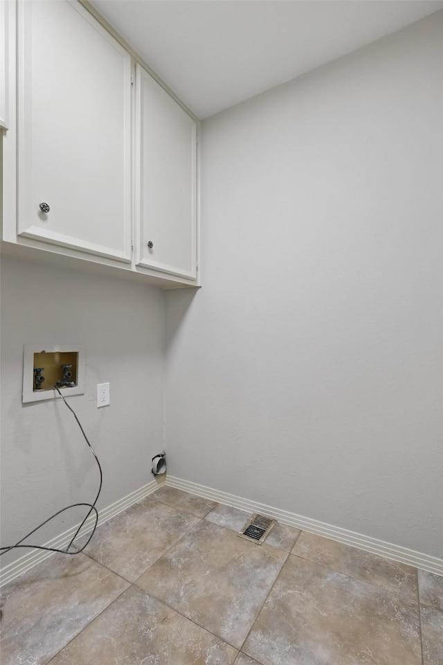 202 Rainbow Cir, Rockwall, TX 75032 - laundry room with cabinet space, hookup for a washing machine, and baseboards